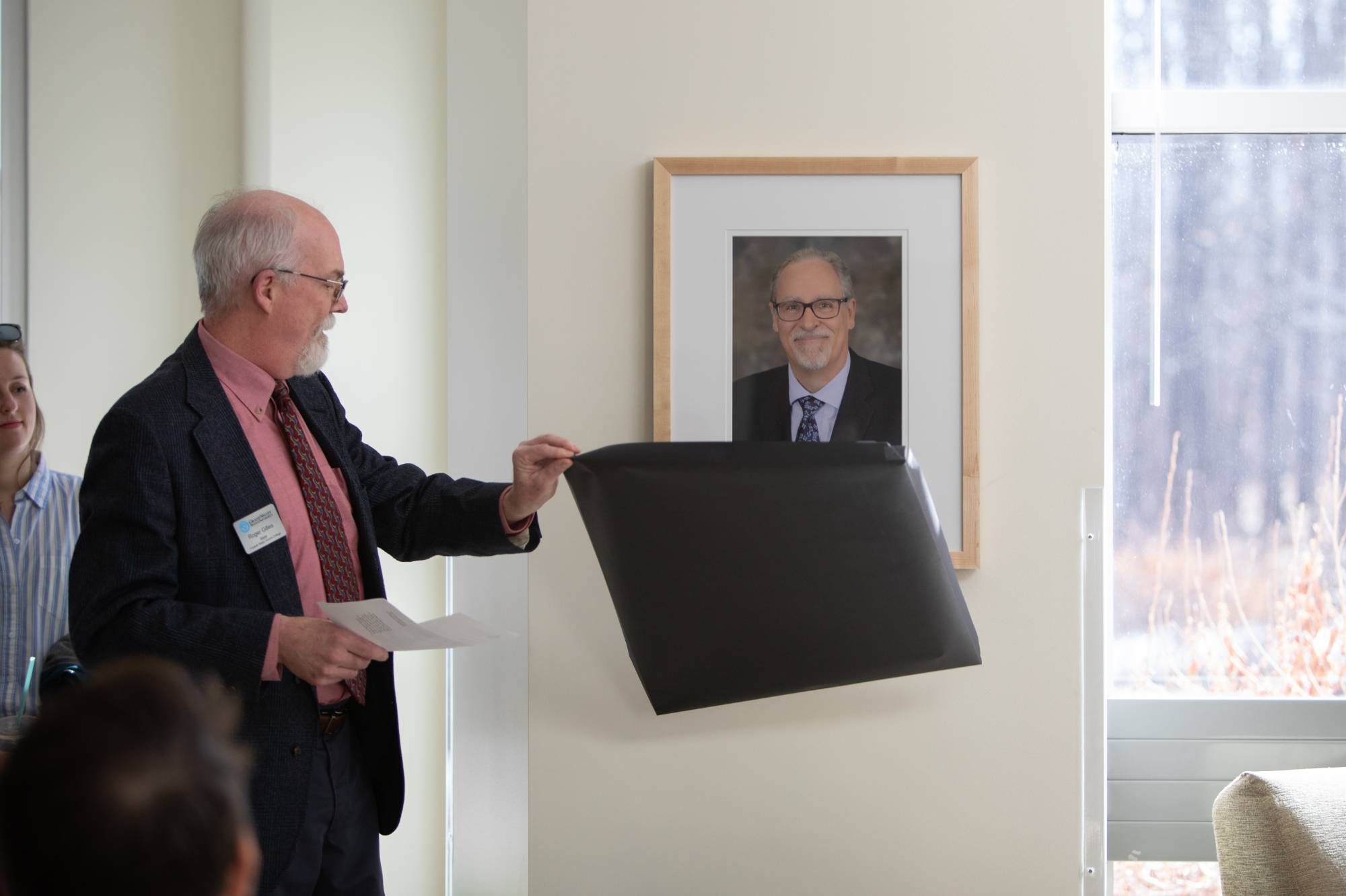 Roger Gilles unveiling the portrait of Dr. J